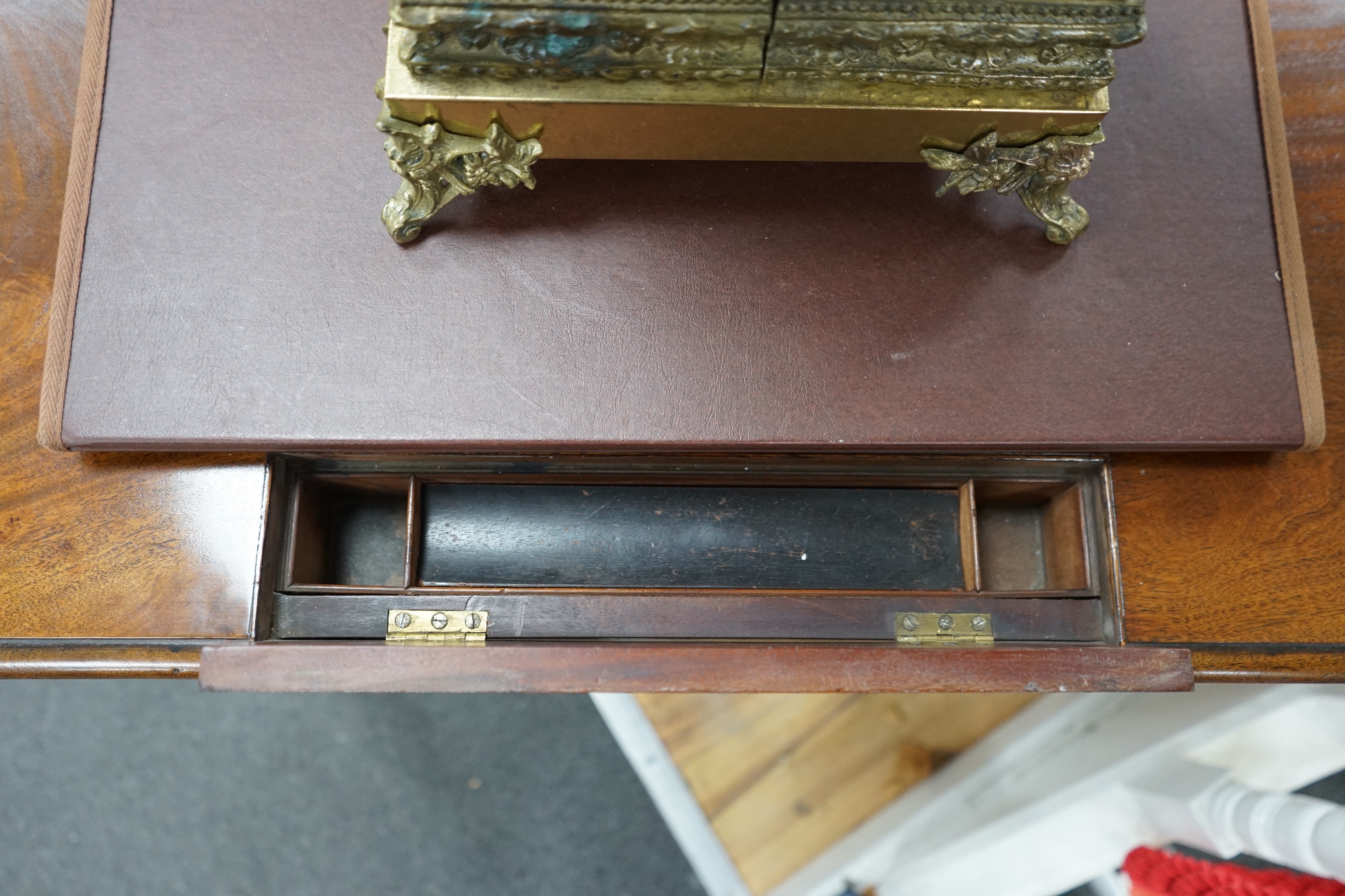 An early Victorian mahogany writing table stamped M Willson, 68 Great Queen Street, width 76cm, depth 48cm, height 74cm